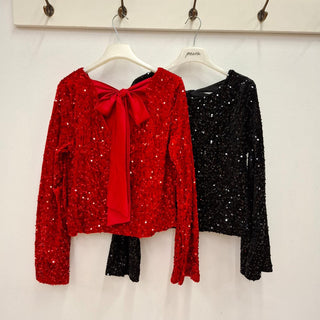 Paljettblus med satinrosett